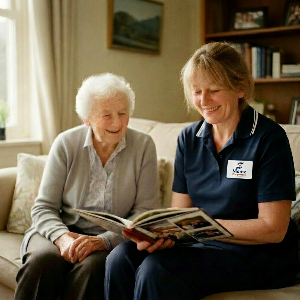 A Niamz companion looking through a photo album with an older woman